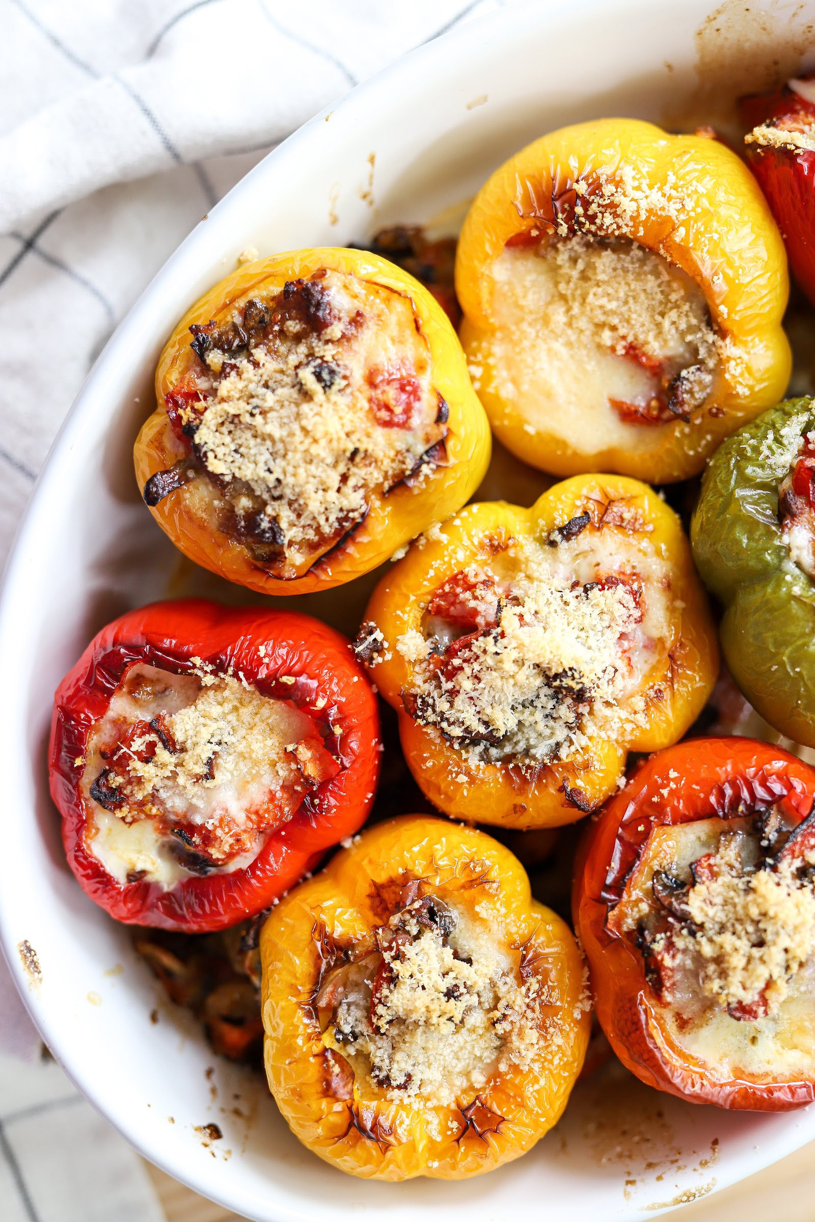 Stuffed baked bell peppers with minced chicken meat, mozzarella and tomatoes