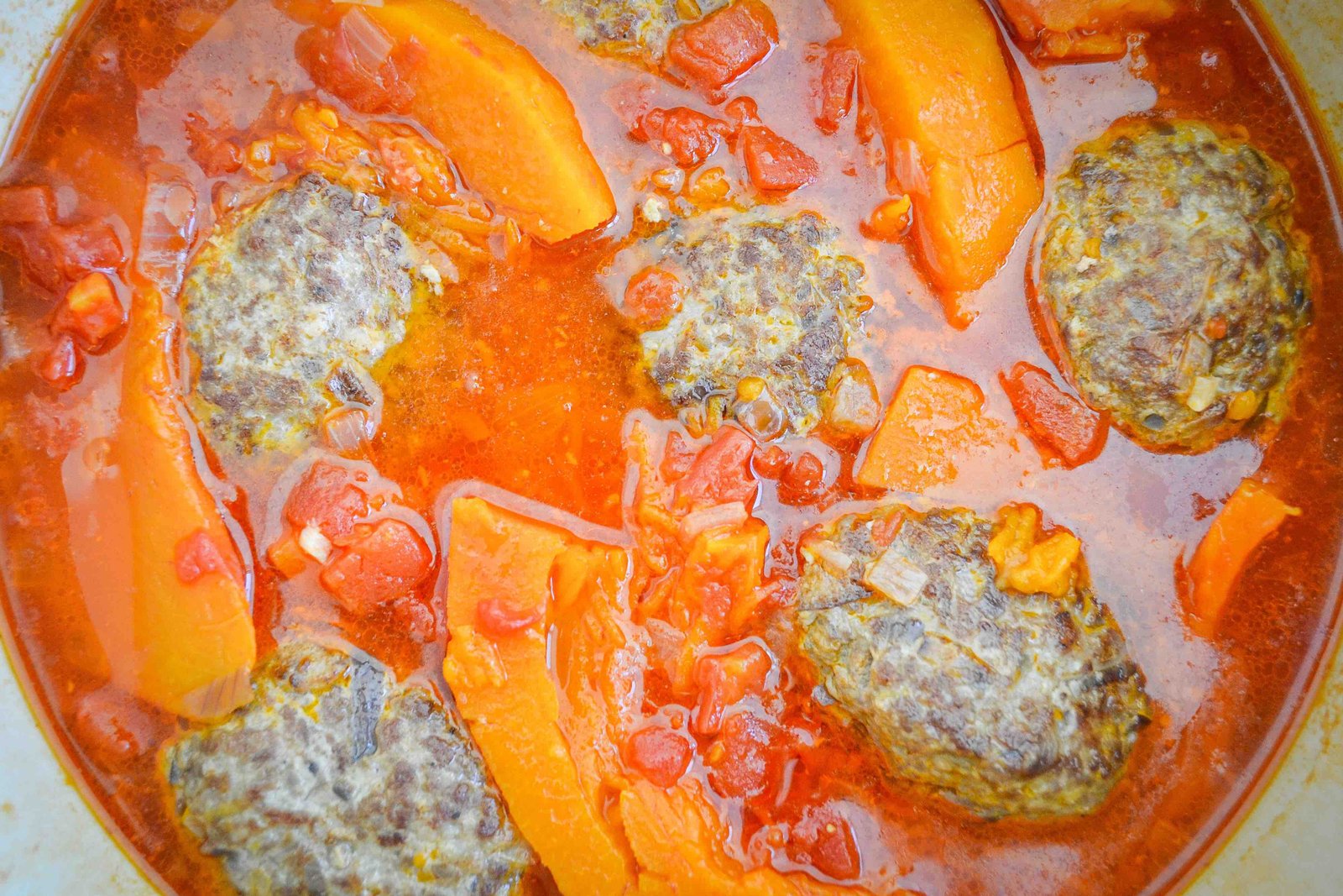 Meatballs in thick tomato sauce with pumpkin